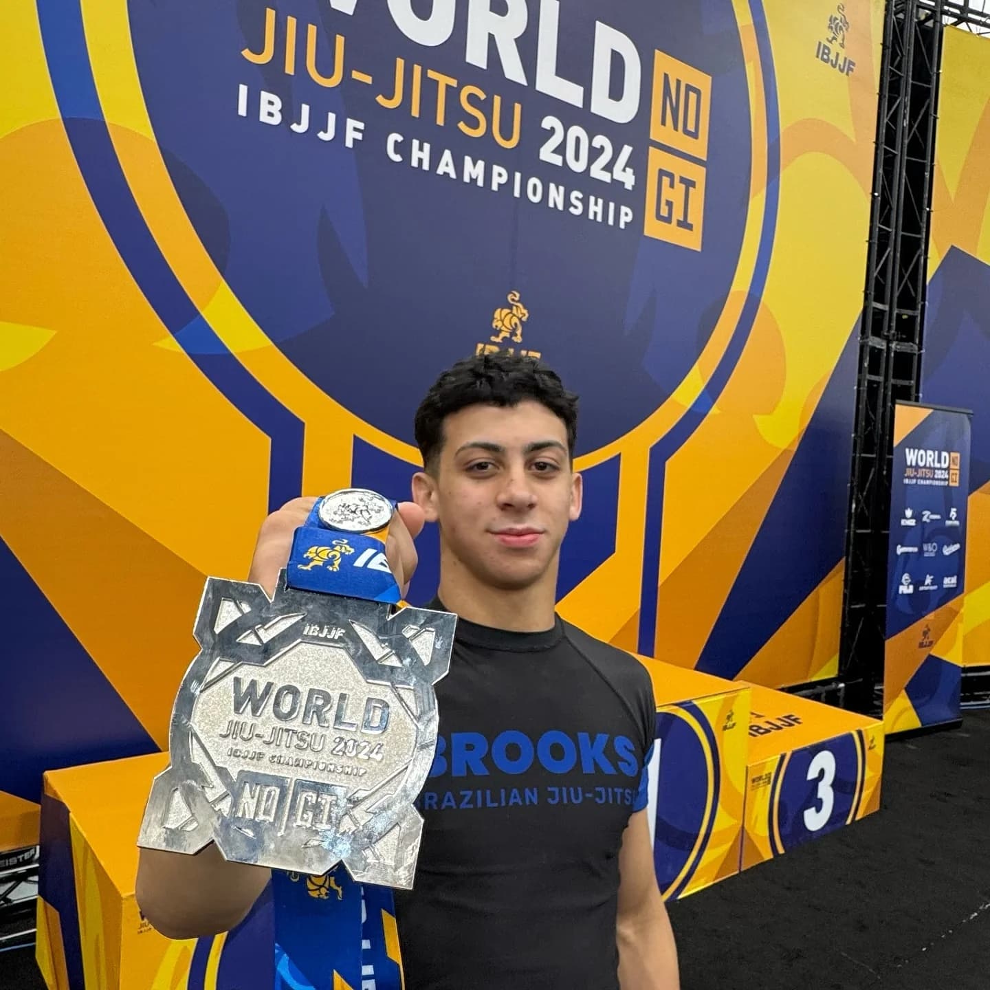 Brooks athlete holding bronze medal at IBJJF World No-Gi Championship 2024
